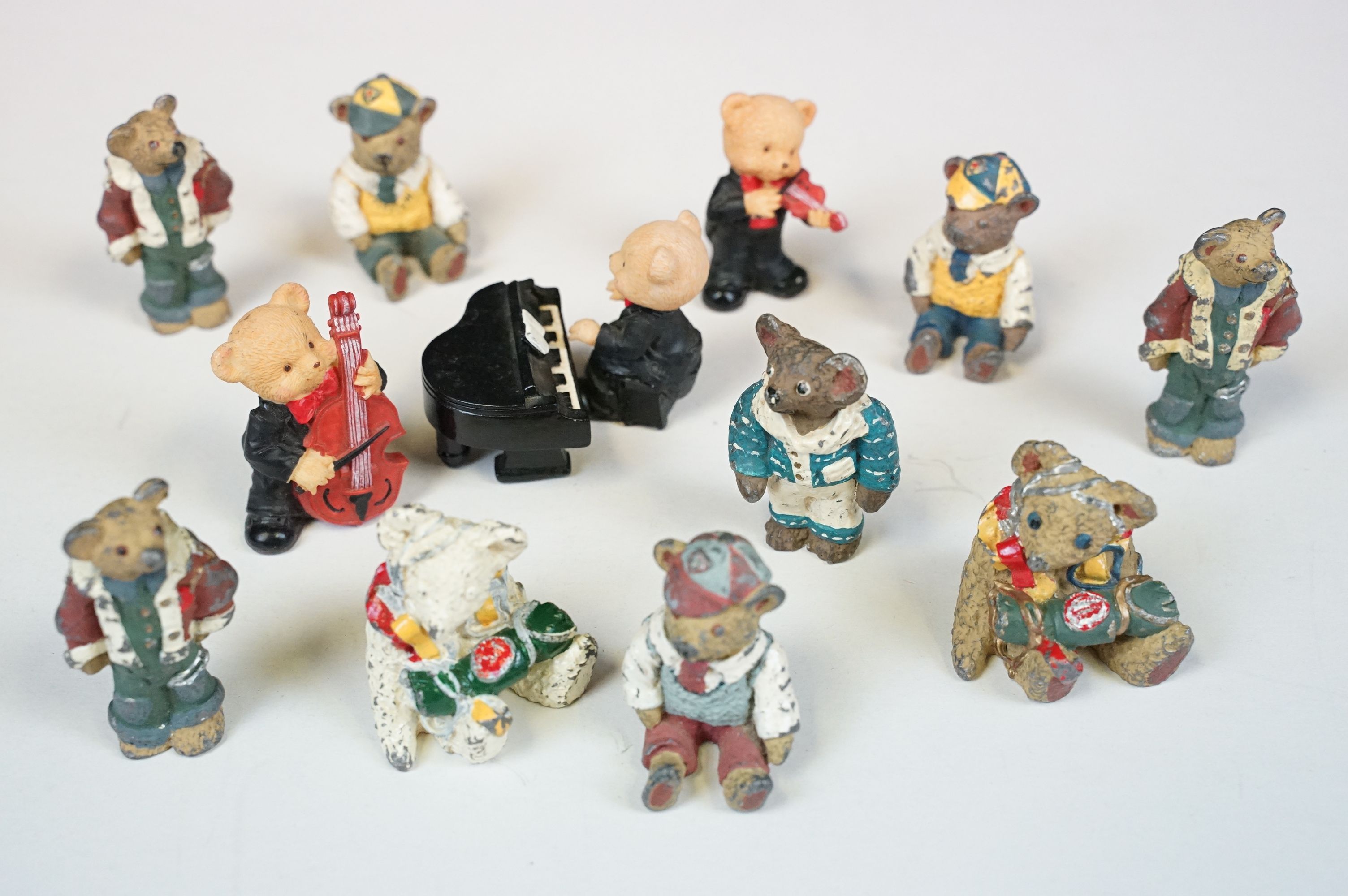 Collection of 11 mainly metal bear figures to include 2 x in RAF pilot outfit, 2 x in school boy