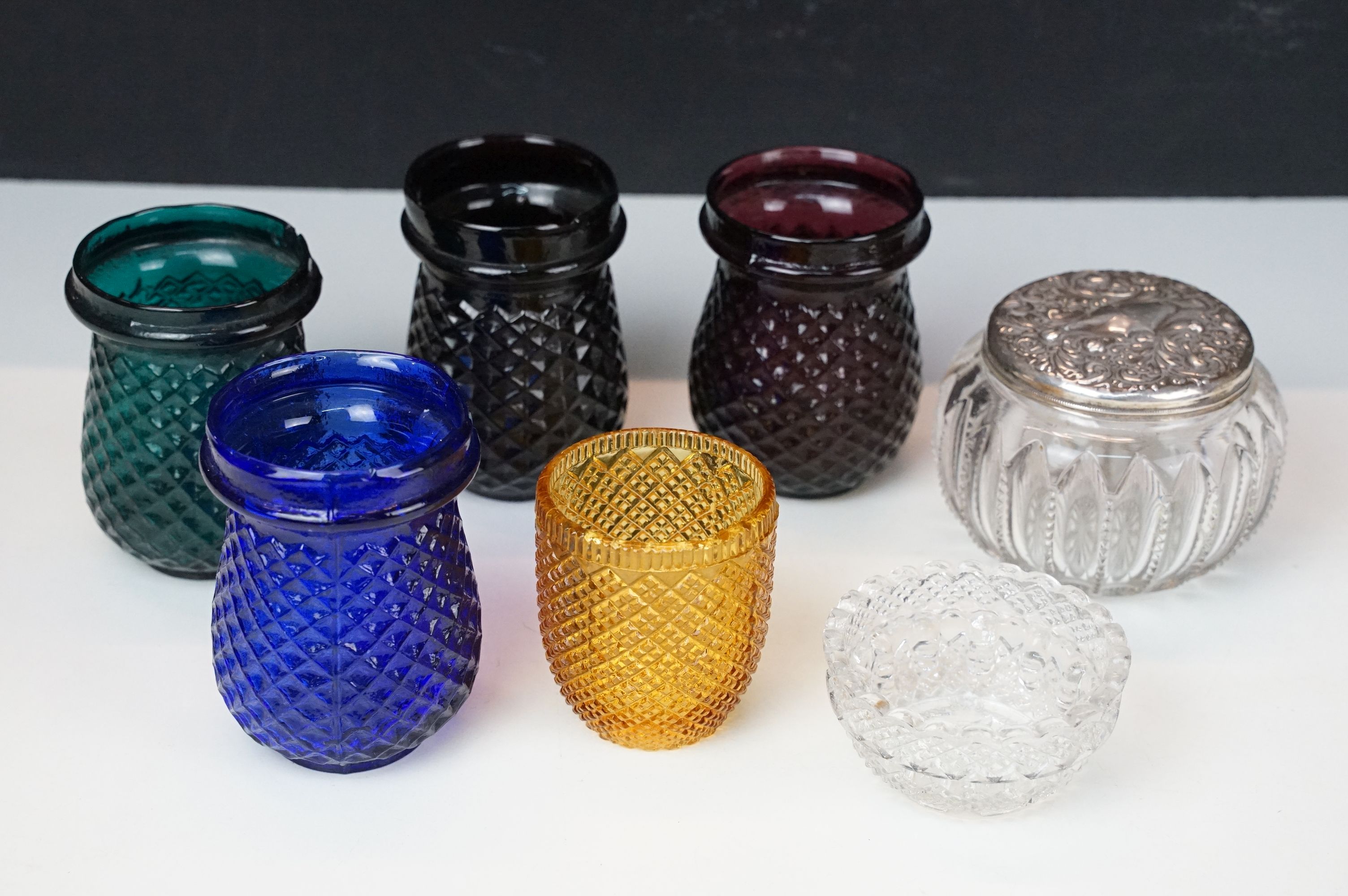 Selection of Victorian pressed glass pieces to include coloured small light holder examples, one