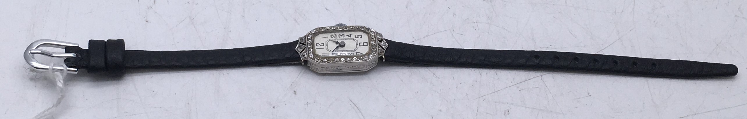 Art Deco platinum and diamond Ladies cocktail watch, dated April 1923 on a leather strap in