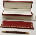 Cartier with original box and documents, packaging and outer packaging a burgundy and gold