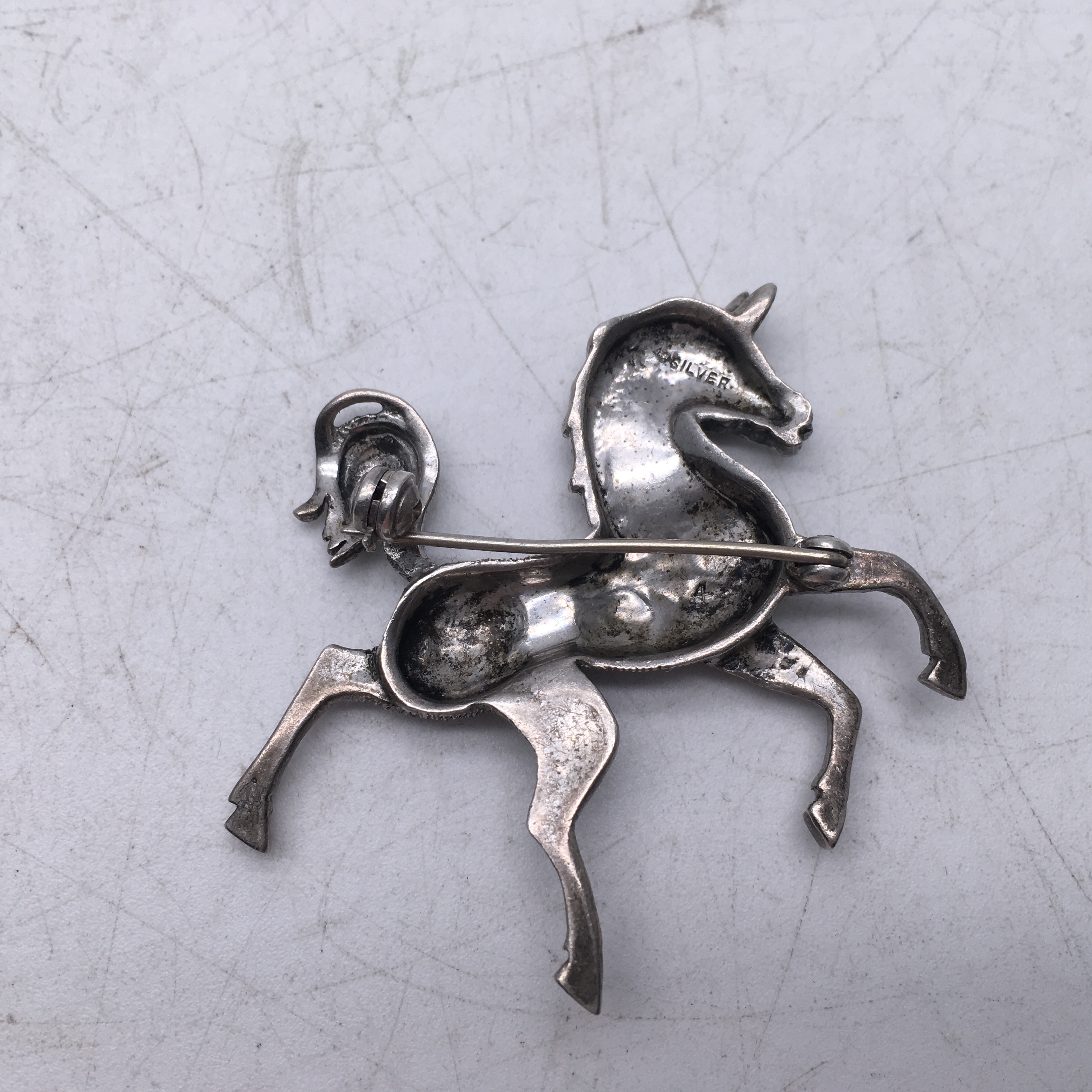 Delicate silver and marcasite brooch modelled as a stylized horse 2inches long - Image 2 of 3