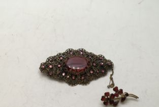 Edwardian ruby glass decorative brooch 3inches long and 1 other brooch