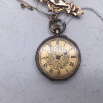 Antique Ladies 9 carat gold Fob watch with gold attachments 1inches dial appears to be working watch