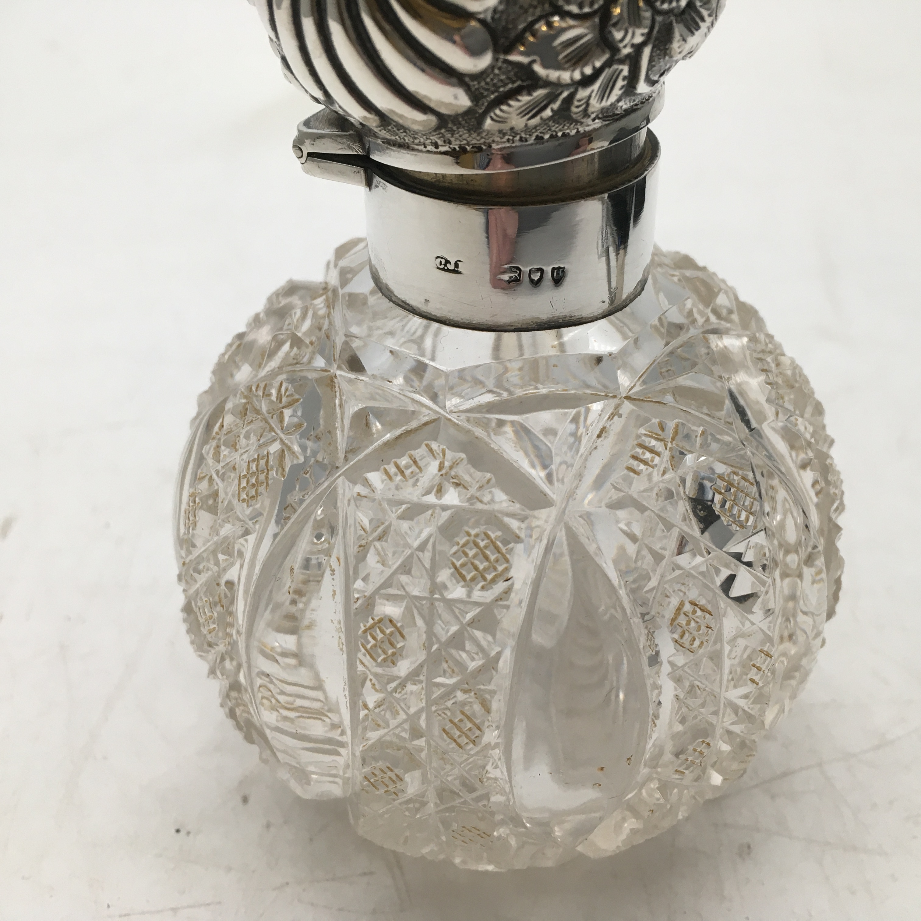 Cut glass base and silver topped scent decanter with original stopper 4.1/2inches tall - Image 2 of 3