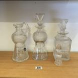 3 Edinburgh crystal, a thistle patterned Decanters with stoppers Claret jug,port and whisky