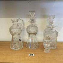 3 Edinburgh crystal, a thistle patterned Decanters with stoppers Claret jug,port and whisky