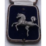 Delicate silver and marcasite brooch modelled as a stylized horse 2inches long