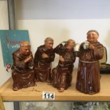 The Card Players a set of 4 x china figurines modelled as Monks playing cards or drinking c1900