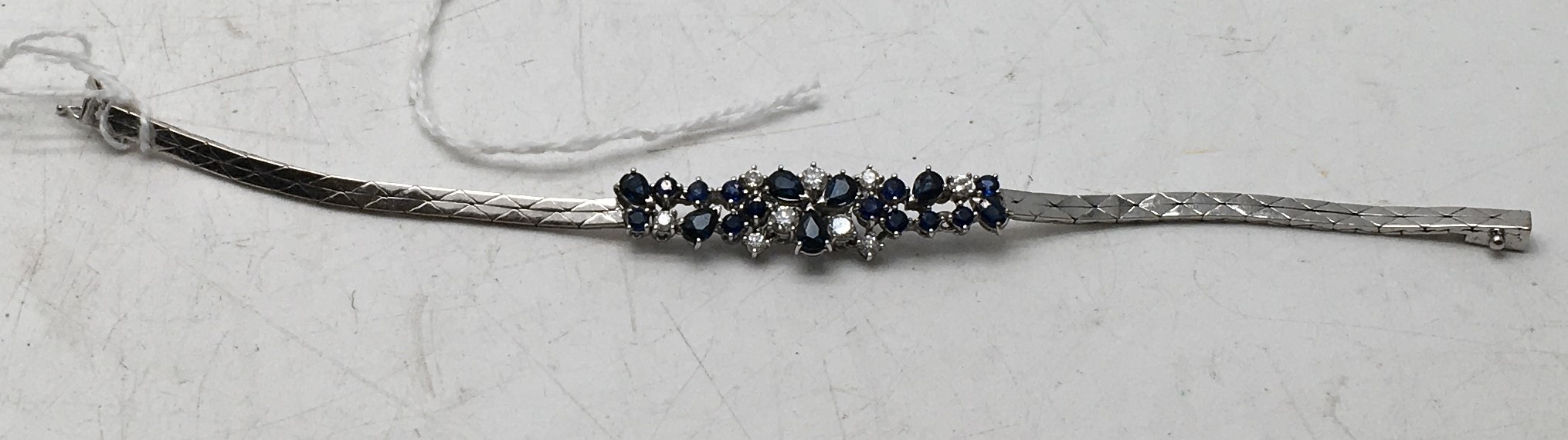 Vintage Delicate 18ct gold marked 750 white gold bracelet, set with Sapphires and diamonds, 8