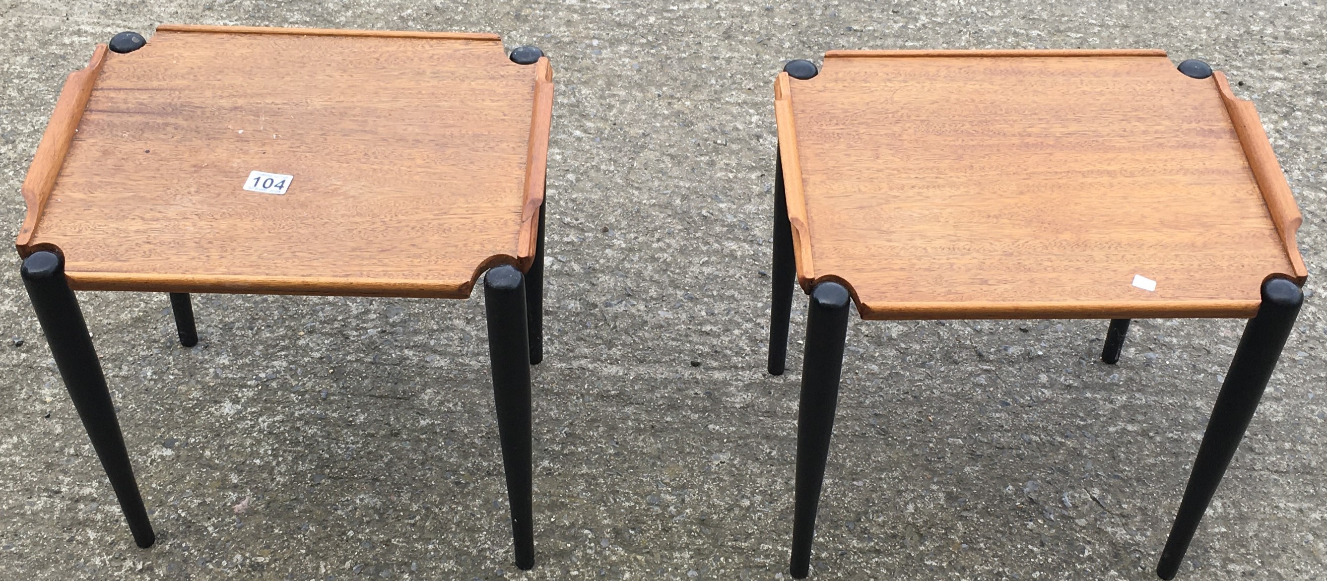 2 black and teak matching mid 20 th century small coffee tables