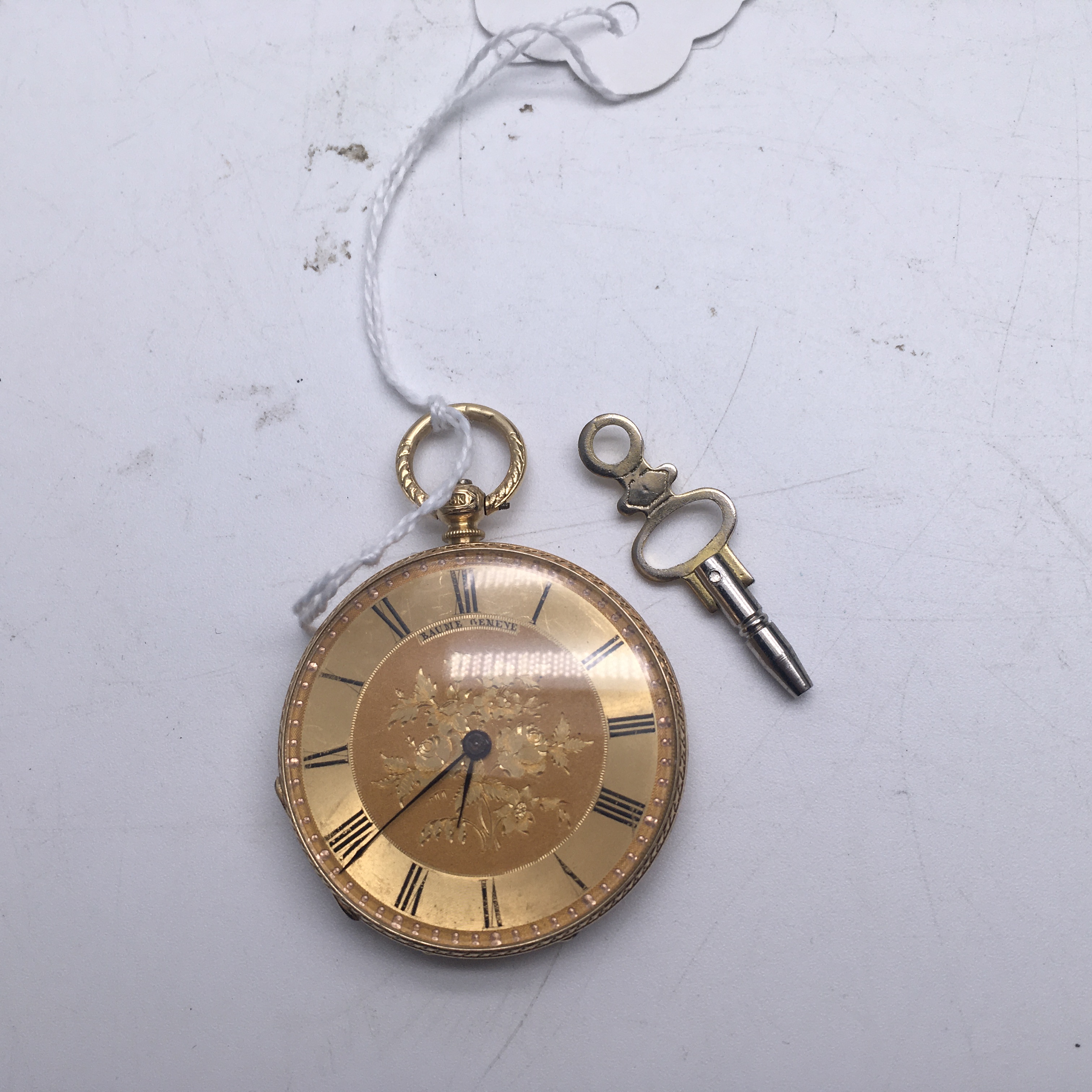 Baume Geneva pocket watch in 18 carat gold with mechanical movement the bessel has floral decoration