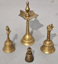 A collection of four brass bells, various design and sizes, (a/f)