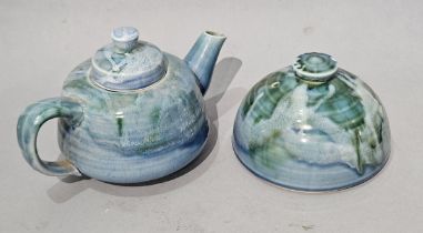 Lamorna Pottery, a Teapot and Butter / Cheese Cover on a blue / green ground, both marked with