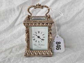An Attractive Carriage Clock With Cast Pillars And Swing Handle, The Dial Signed Chas Frodsham