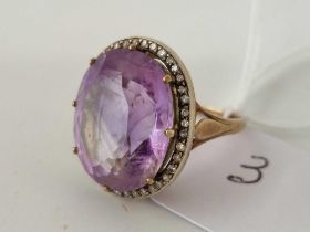 An amethyst and diamond ring, set in gold, size N, 8.2 g