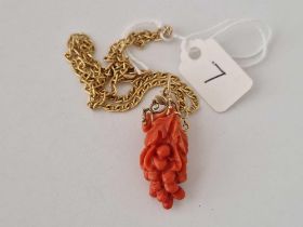 A coral pendant in the form of a bunch of grapes on 9ct neck chain, 15 inch 4.4 g inc