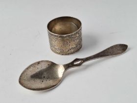 A fancy engraved napkin ring 1896 and a honey spoon, 63g