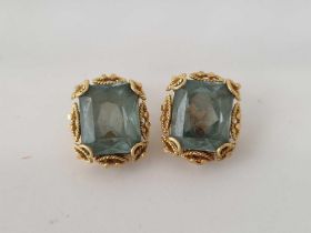 A PAIR OF GEM SET MOUNTED EAR CLIPS, SET IN GOLD, 7.7g