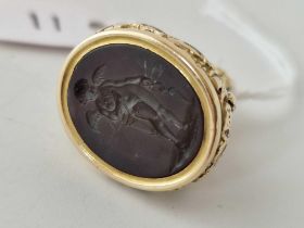 A 19th century gold cased intaglio seal fob with cherub