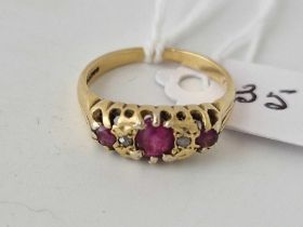 A ruby and diamond ring 18ct gold size M 3.5 gms