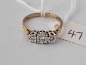 A three stone diamond illusion set ring, 9ct