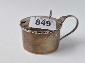 A circular mustard pot with scroll handle, Birmingham 1934, 53g excluding B.G.L