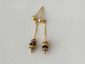 A pair of 18ct gold ear drops 2.7 gms