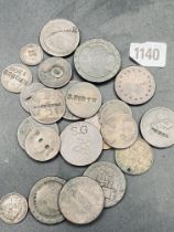 Tub of counter marked coins