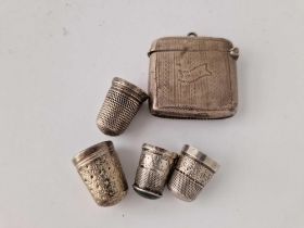 An engraved vesta case 1916 and four silver thimbles