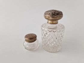 A cut glass scent bottle with embossed cover, London 1882 and a mounted jar