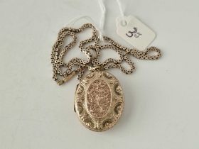 A oval fancy locket in two colour gold on gilt square link box chain 15 inch