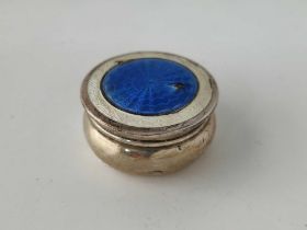 A circular silver and enamel pill box and cover, chipped, 1.5" diameter, Birmingham 1911