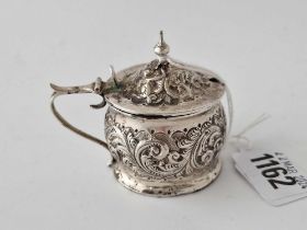 A circular embossed mustard pot with BGL, Birmingham 1893 by J & B