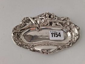 An Art Nouveau shaped oval dish with figures and flowers, 6 inches long, stamped sterling, 54 g