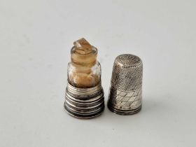 A thimble shaped scent bottle with glass interior and screw on base, unmarked