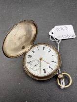 A silver hunter pocket watch with seconds dial
