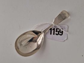 A crested Victorian caddy spoon with oval bowl, London 1843 by GA