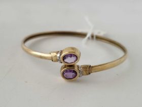 A bangle set with amethysts and diamonds 9ct 6.9 gms