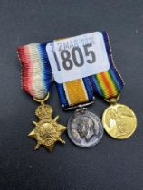 A group of three miniature WWI medals