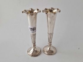 A pair of spill vases on trumpet shaped stems, half fluted, 6 inches high, London 1899