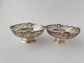 A good pair of sweet dishes with pierced sides, spreading bases, 4.5" diameter, Sheffield 1927,