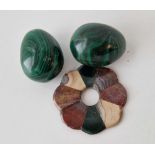 A bag containing two Malachite eggs and a Scottish silver agate brooch