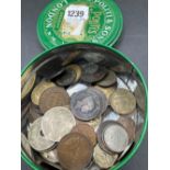 A round tin of assorted coins