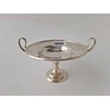 A pedestal dish with two loop handles and spreading base, 6 inches wide, London 1904, 146 g
