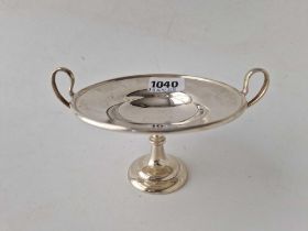 A pedestal dish with two loop handles and spreading base, 6 inches wide, London 1904, 146 g