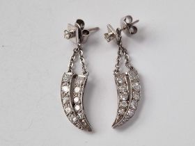 A PAIR OF CLAW SHAPED EARRINGS, SET WITH DIAMONDS, 18ct, 5.9 g.