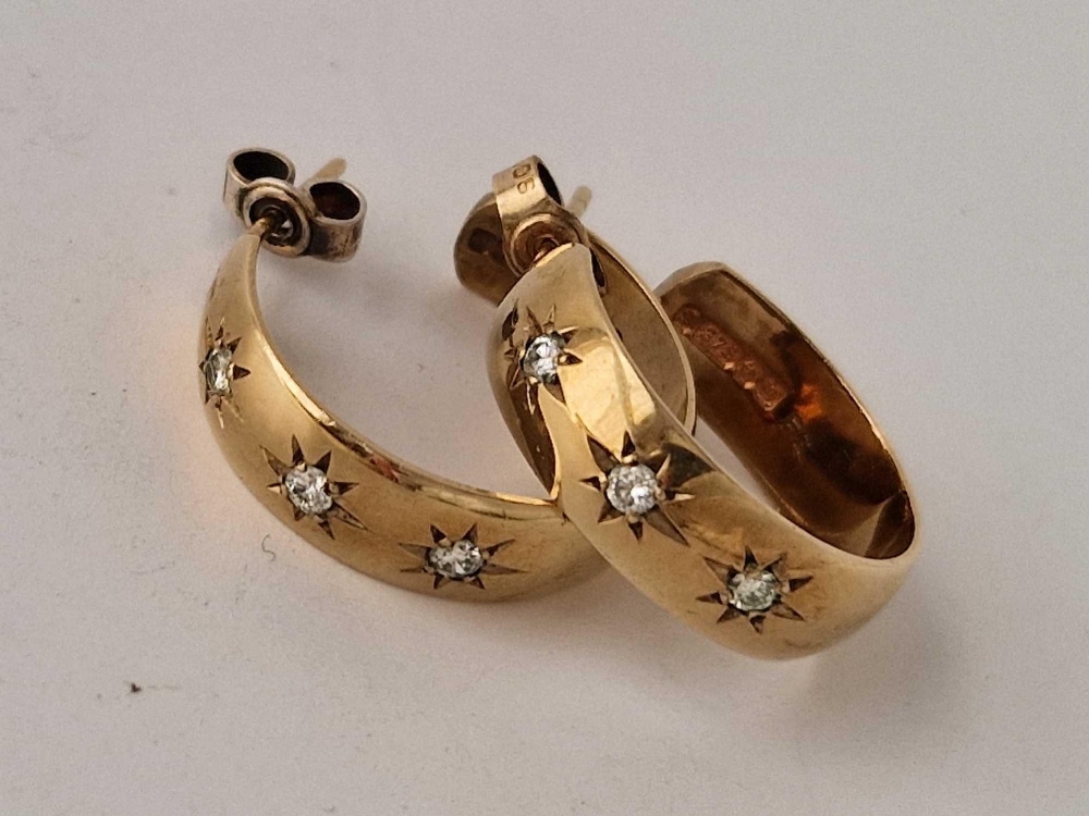 A pair of diamond gypsy set earrings 9ct 5.7g