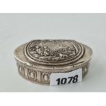 An oval Dutch snuff box with chased decoration, 3 inches wide,