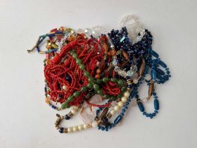 A bag of assorted costume jewellery inc bead necklaces etc.