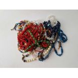 A bag of assorted costume jewellery inc bead necklaces etc.